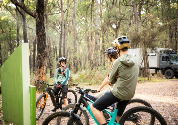 Riders looking at a trailhead sign. Downloadable our high resolution Ride Forrest Trail Map here, our trail map is georeferenced and it includes trail alignment data and contour lines.